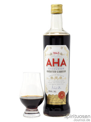 eine Flasche Aha Excelsior Kräuter-Liqueur nebst Glas