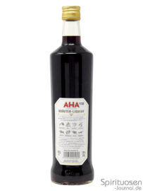 eine Flasche Aha Excelsior Kräuter-Liqueur von hinten